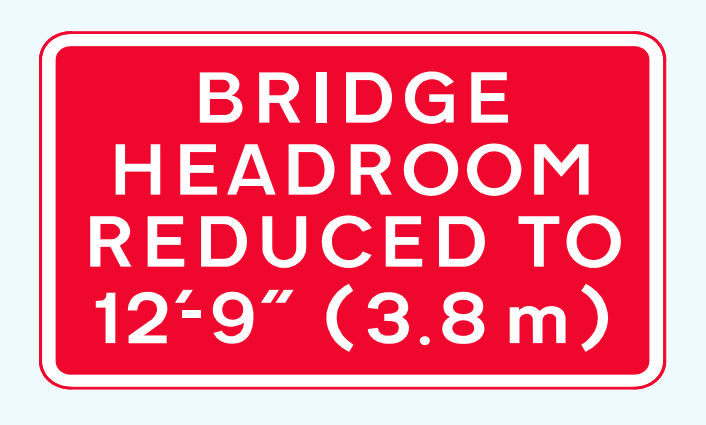 Dual bridge headroom sign