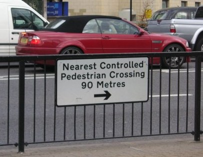 Metric pedestrian crossing sign